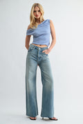 Front view of woman wearing high-rise relaxed Beach to Bar denim pants