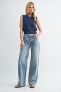Front view of woman wearing 90s low-rise baggy wide-leg denim jeans