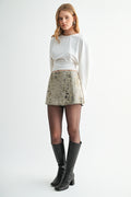 Front view of high-rise printed leopard pattern denim skort
