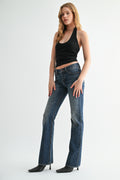 Front view of woman wearing classic mid-rise bootcut denim jeans